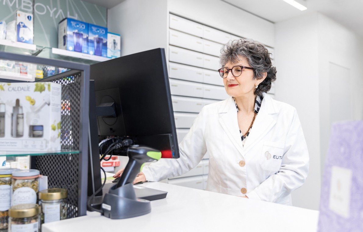 a pharmacist using their computer